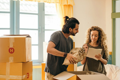 Couple with boxes moving